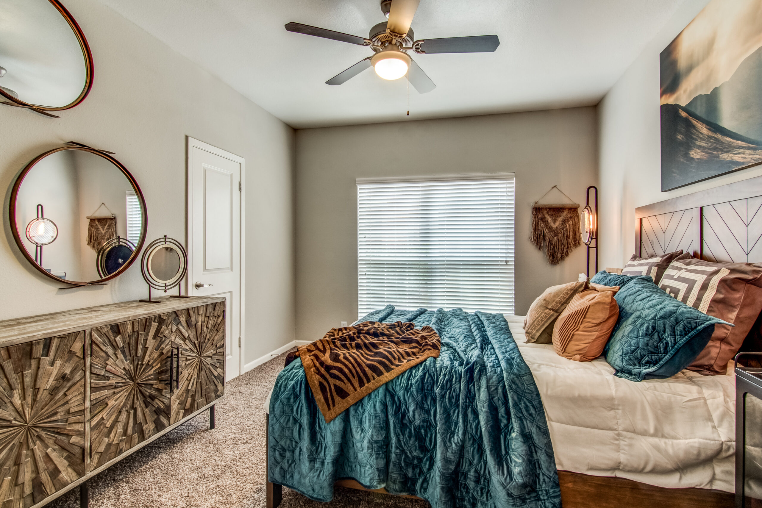 model bedroom with carpet and ceiling fan
